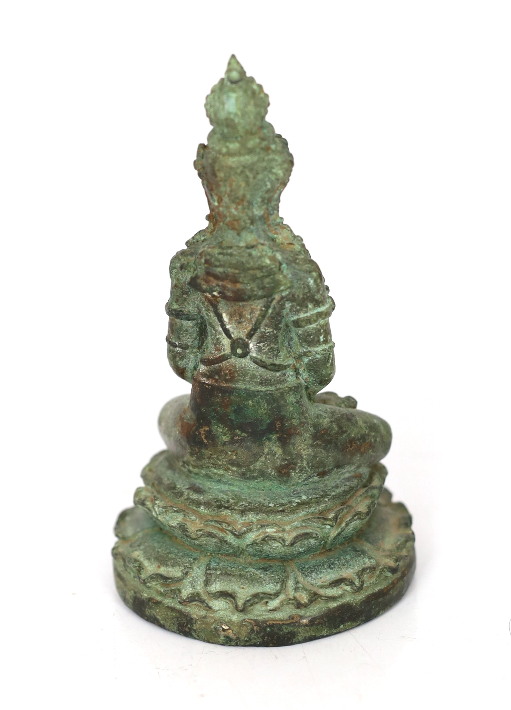 A bronze seated figure of Tara, Central Java, 9th century